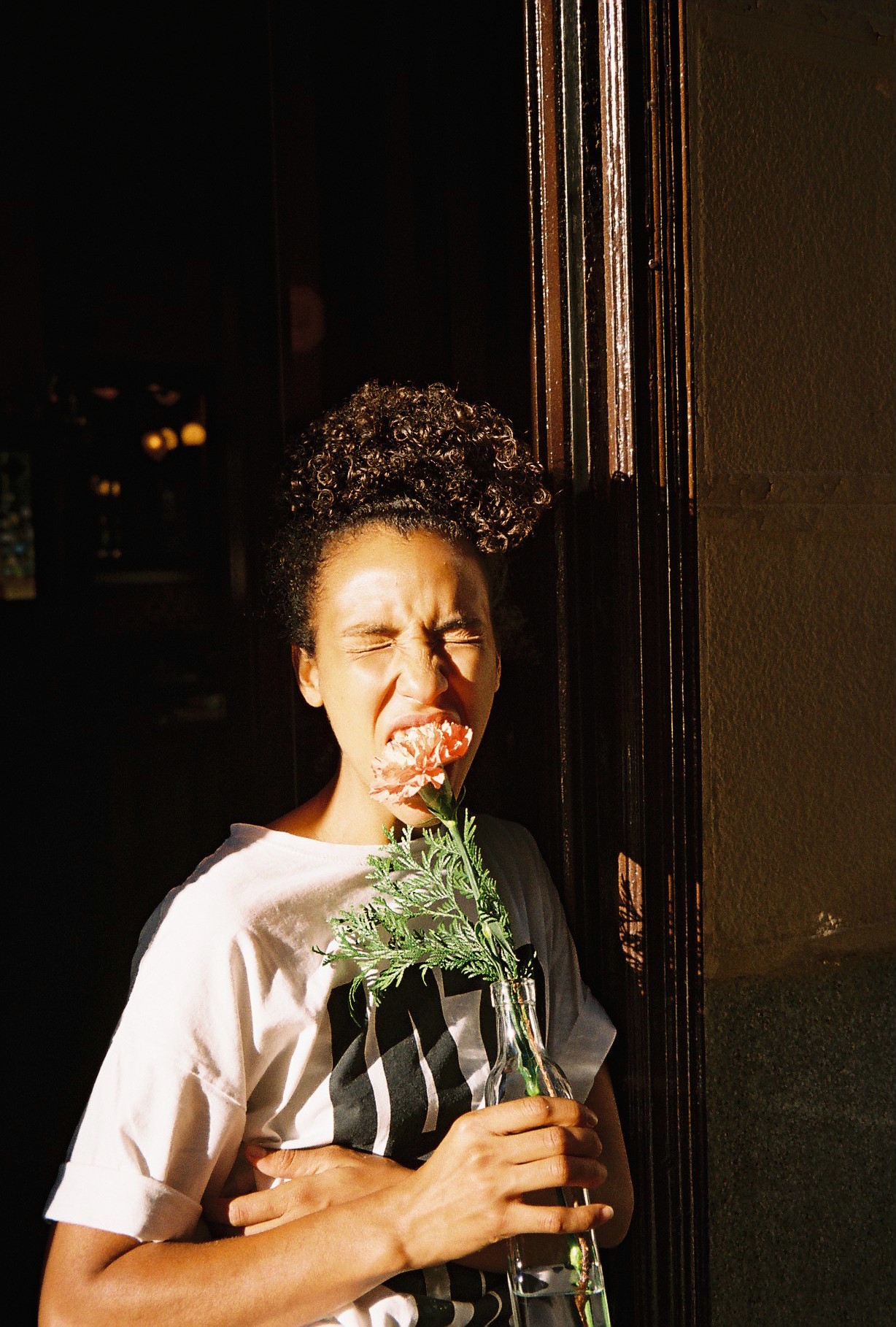 Haila bites a carnation